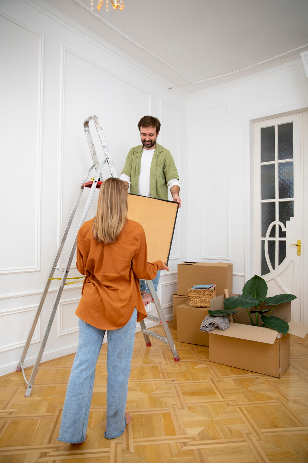 Winchester Painter professional taking down artwork